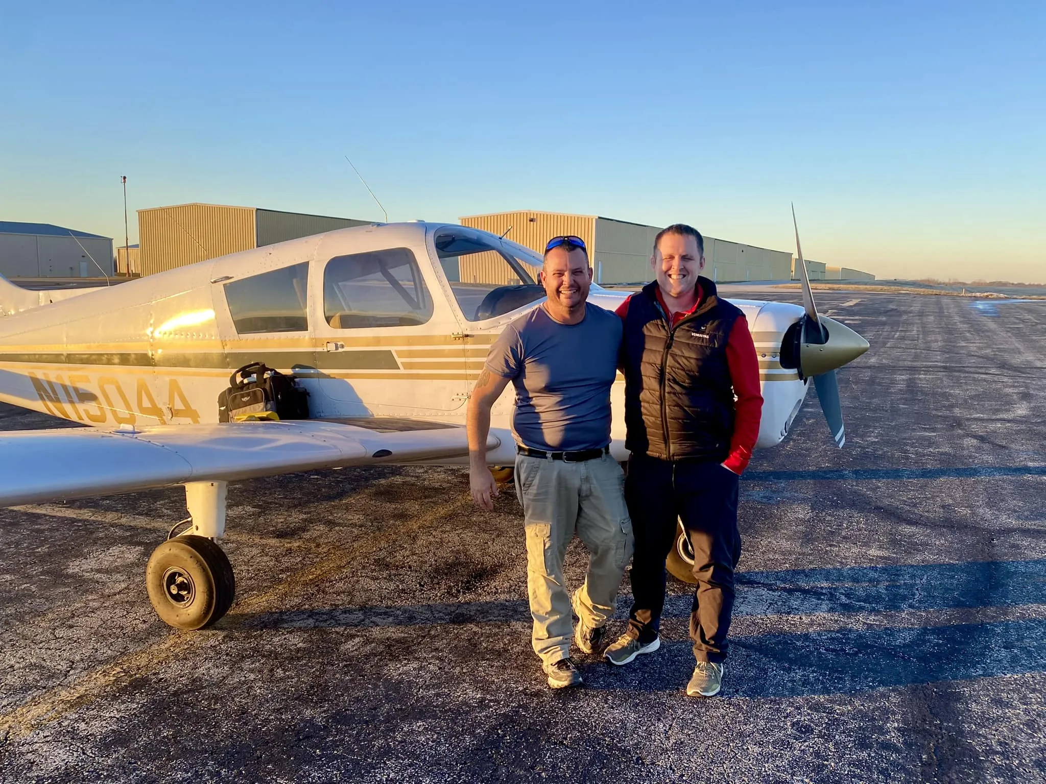 Student and CFI together after a sunset flight at Lee's Summit Airport near Kansas City, MO